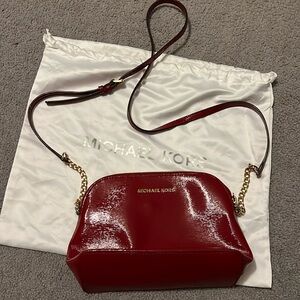 Excellent condition Michael Kors red patent leather crossbody bag.